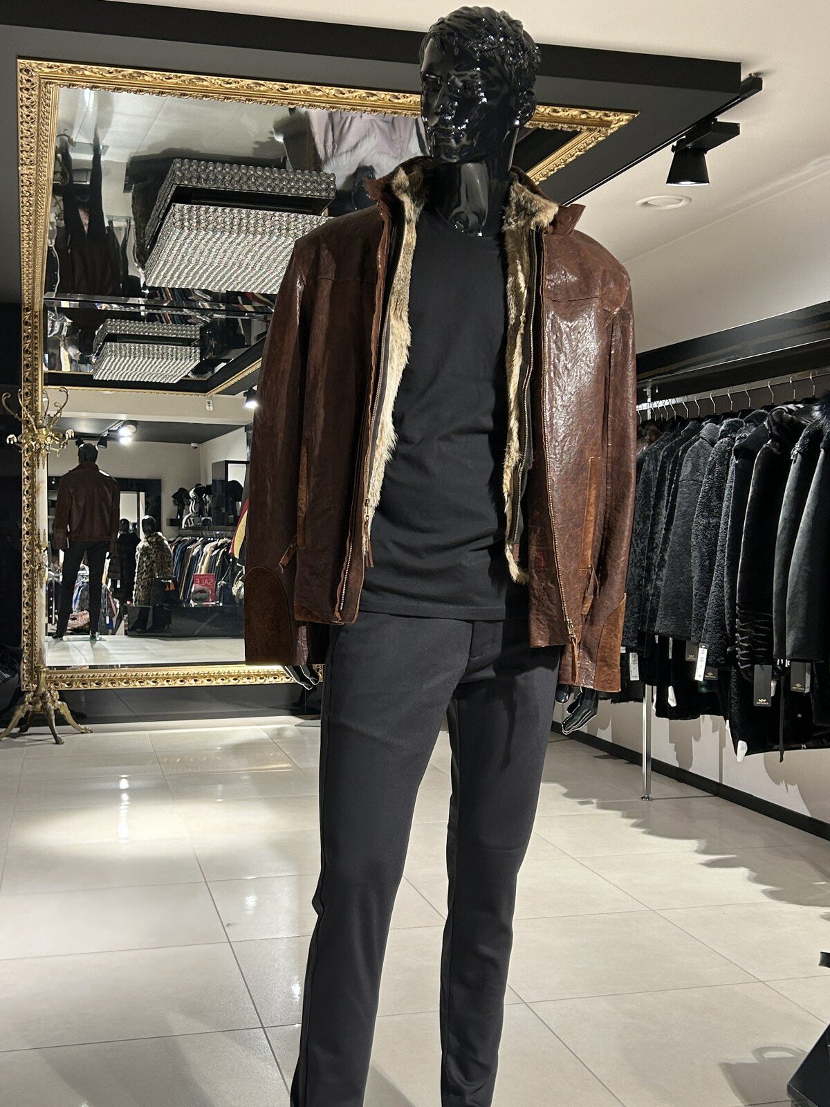 Brown leather jacket with raccoon fur lining
